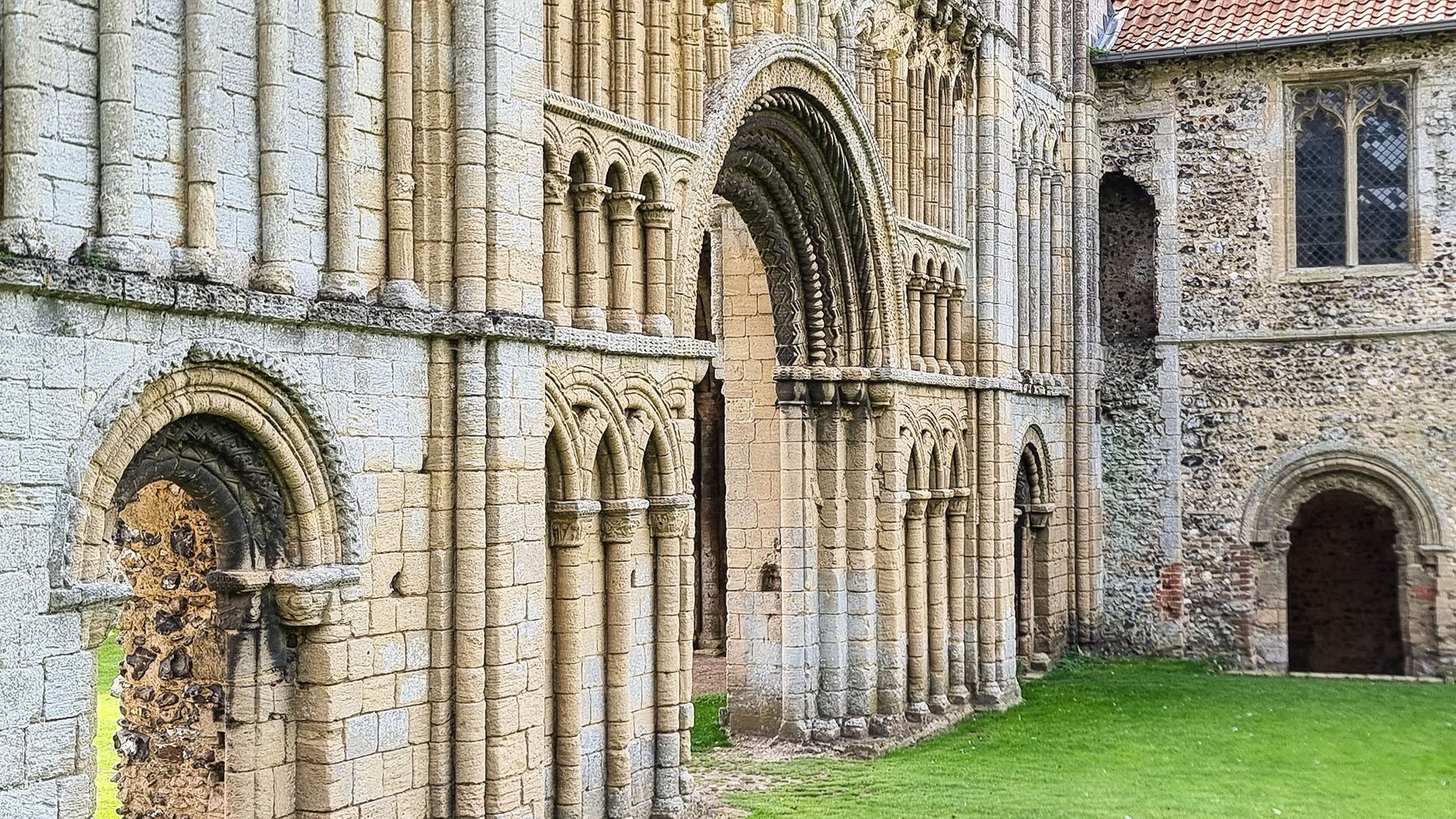 The ornate west facade of Castle Acre Priory church