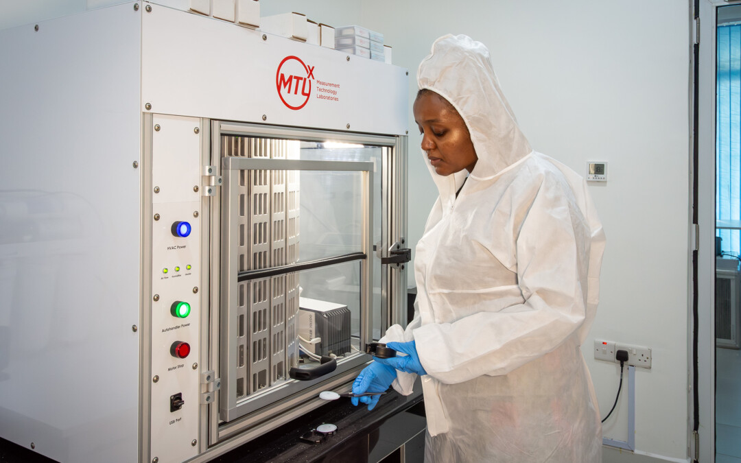 Laboratory technician Joan Kinya preparing filters for weighing with the new MTL automated balance at KEMRI
