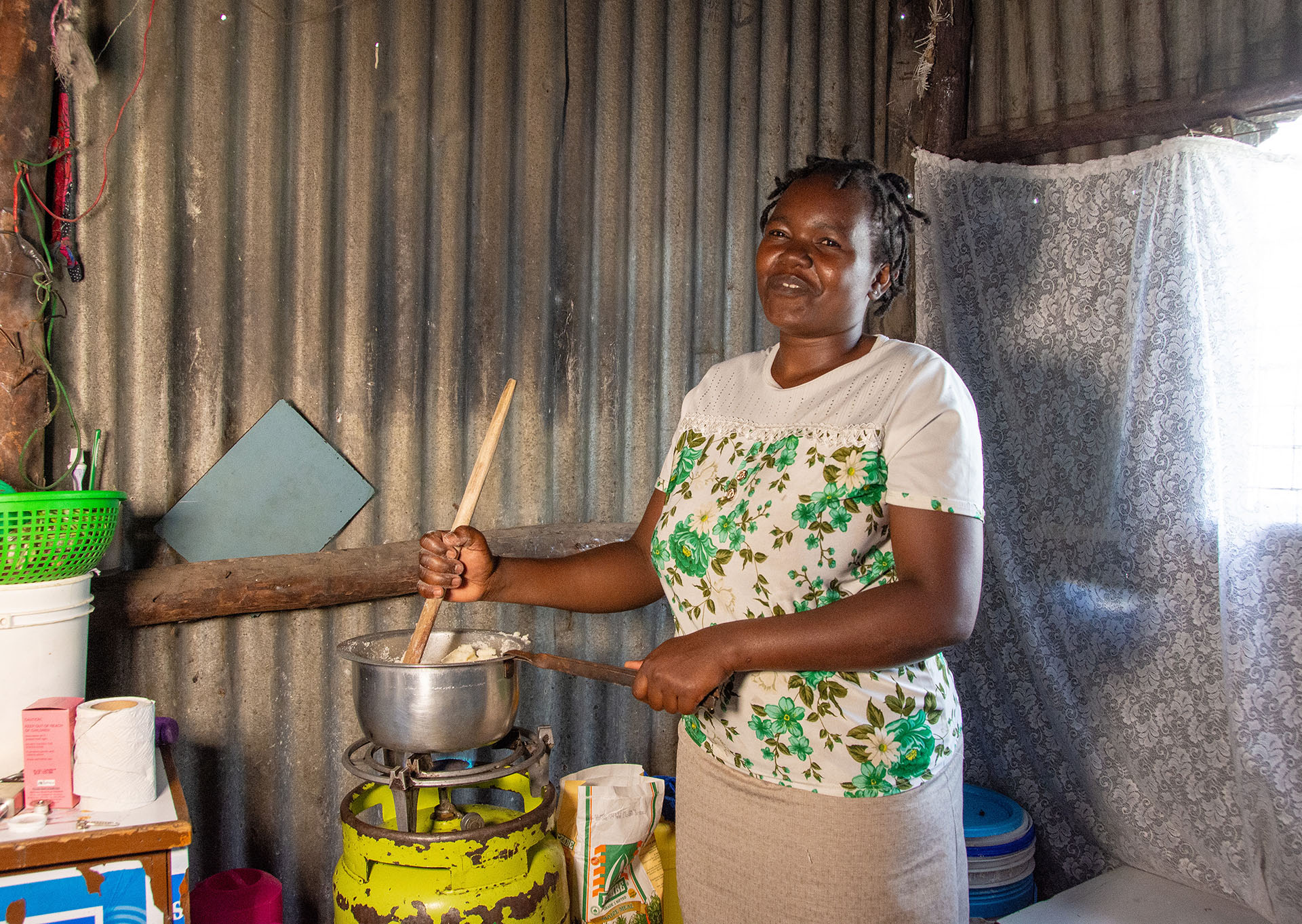Cooking ugali with an LPG 'Meko' stove in Mukuru District, Nairobi
